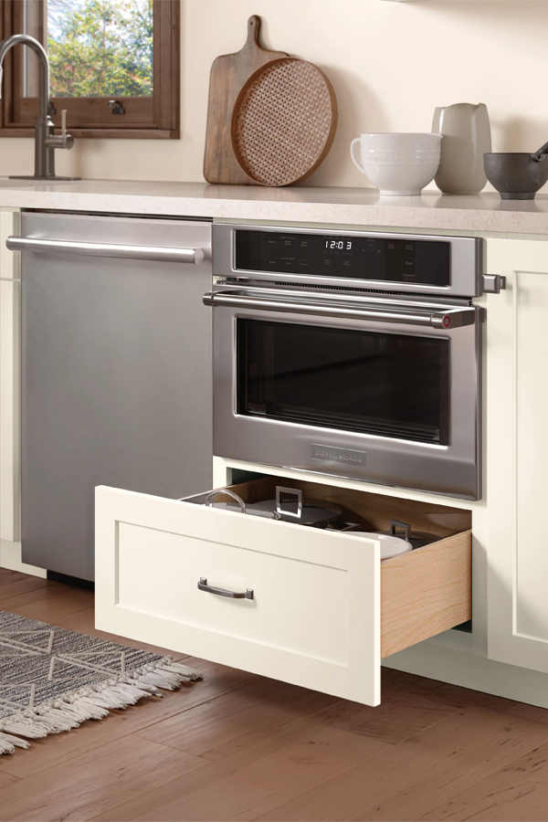 white open cabinet under microwave